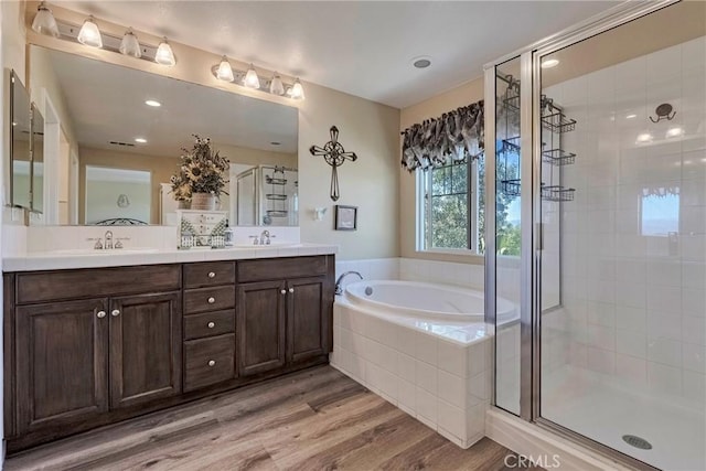 19639 Ellis Henry Ct, Newhall, CA 91321 - bathroom featuring a shower stall, a bath, double vanity, and wood finished floors