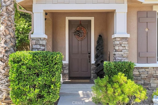 19639 Ellis Henry Ct, Newhall, CA 91321 - view of exterior entry featuring stone siding and stucco siding