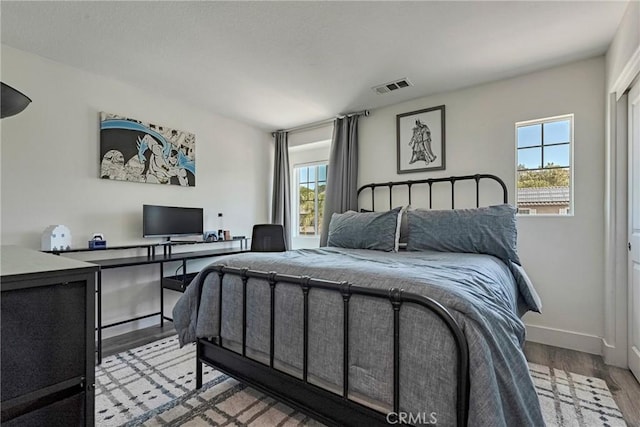 19639 Ellis Henry Ct, Newhall, CA 91321 - bedroom featuring wood finished floors and an office area