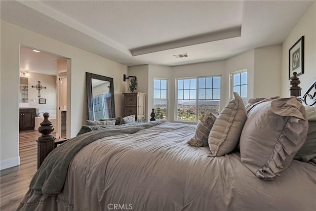 19639 Ellis Henry Ct, Newhall, CA 91321 - bedroom featuring wood finished floors and a raised ceiling