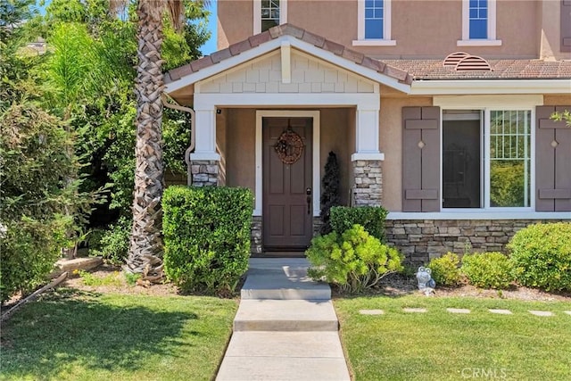 19639 Ellis Henry Ct, Newhall, CA 91321 - entrance to property featuring stone siding, stucco siding, and a lawn