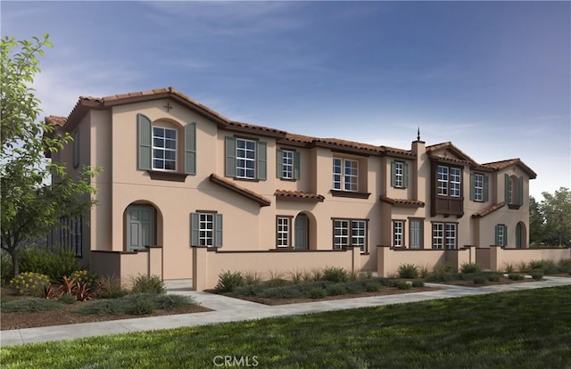 4283 E Carmel Privado St, Ontario, CA 91761 - mediterranean / spanish-style house featuring a fenced front yard, a tiled roof, and stucco siding
