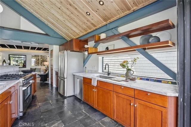 686 Diamond St, Laguna Beach, CA 92651 - kitchen with stainless steel appliances, open shelves, brown cabinets, lofted ceiling, and light stone countertops