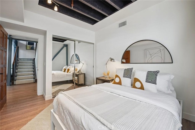 686 Diamond St, Laguna Beach, CA 92651 - bedroom featuring wood finished floors and a closet