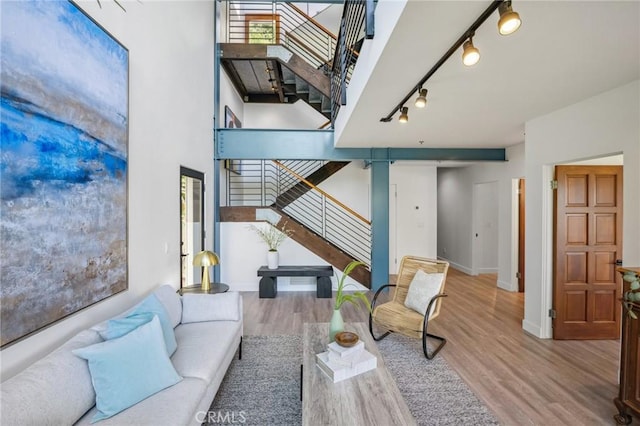 686 Diamond St, Laguna Beach, CA 92651 - living area with stairway, rail lighting, and wood finished floors