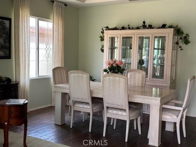 28433 Oasis View Cir, Menifee, CA 92584 - dining room with healthy amount of natural light and dark wood-type flooring