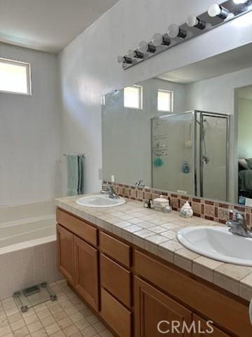 28433 Oasis View Cir, Menifee, CA 92584 - full bathroom with a stall shower, double vanity, a garden tub, and tile patterned floors