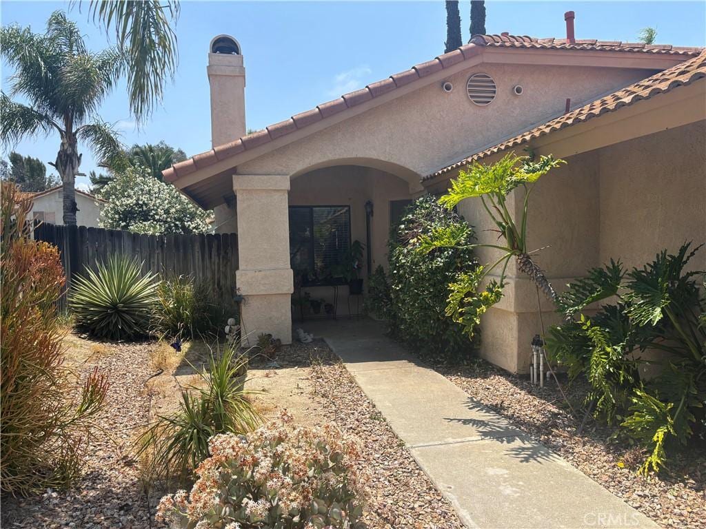39830 Creative Dr, Temecula, CA 92591 - property entrance with stucco siding and a tile roof