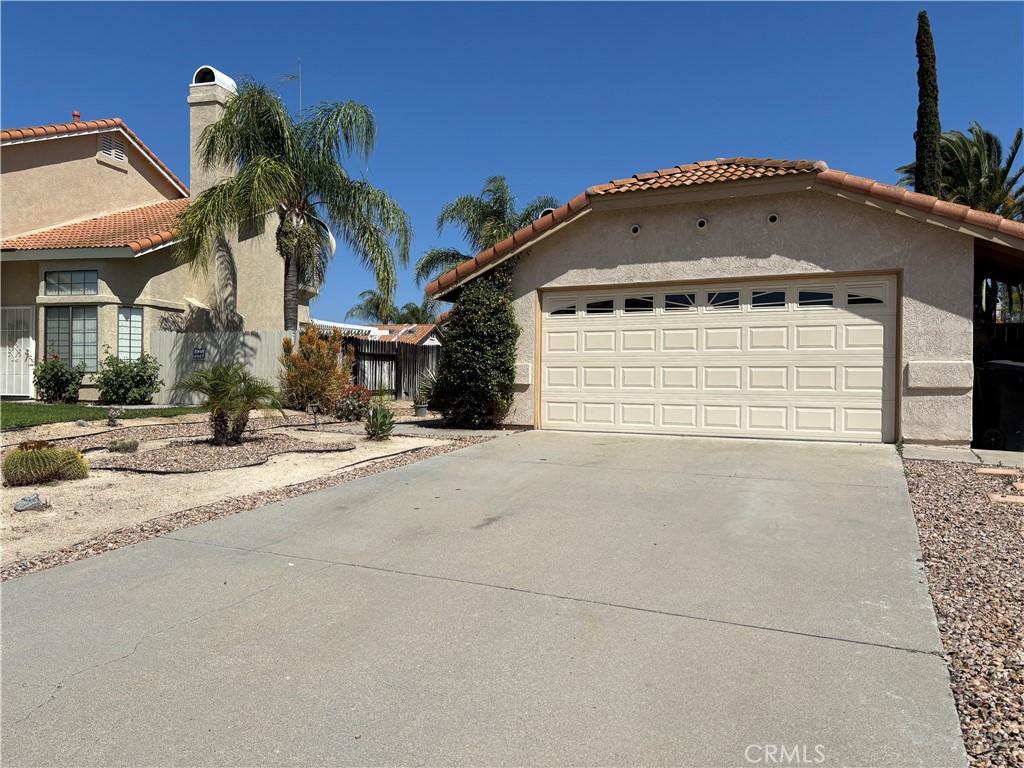 39830 Creative Dr, Temecula, CA 92591 - mediterranean / spanish-style home with driveway, stucco siding, a garage, and a tiled roof