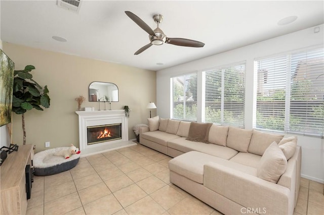1182 Chenin Blanc Cir, Perris, CA 92571 - living area with a ceiling fan, light tile patterned flooring, and a glass covered fireplace