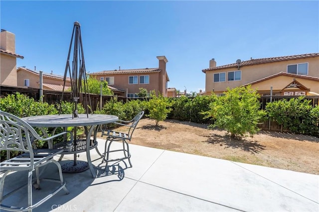 1182 Chenin Blanc Cir, Perris, CA 92571 - fenced backyard with outdoor dining area and a patio area