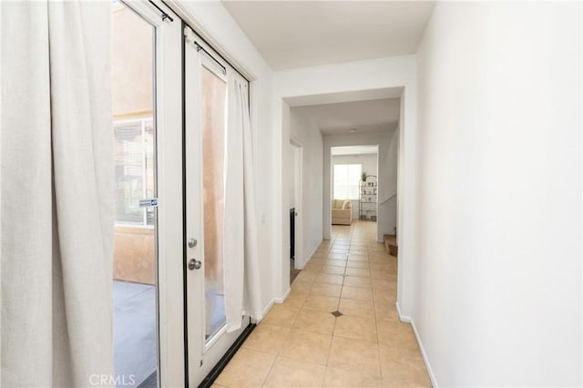 1182 Chenin Blanc Cir, Perris, CA 92571 - corridor with light tile patterned floors and baseboards