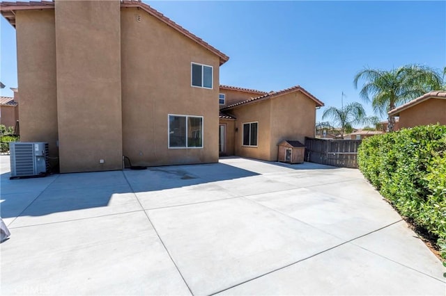 1182 Chenin Blanc Cir, Perris, CA 92571 - back of house with stucco siding, a tiled roof, and a patio area