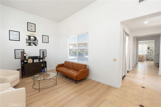 1182 Chenin Blanc Cir, Perris, CA 92571 - living area featuring plenty of natural light, light wood-style flooring, and recessed lighting