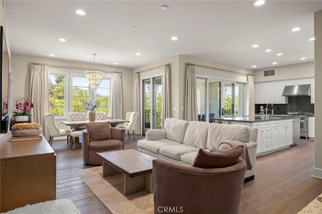23500 Park Sorrento Unit H32, Calabasas, CA 91302 - living room with a chandelier, plenty of natural light, recessed lighting, and wood finished floors