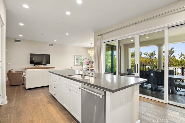 23500 Park Sorrento Unit H32, Calabasas, CA 91302 - kitchen featuring dishwasher, dark countertops, recessed lighting, light wood-style floors, and plenty of natural light