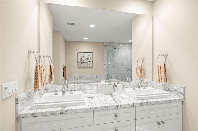 23500 Park Sorrento Unit H32, Calabasas, CA 91302 - full bath with double vanity, a marble finish shower, and recessed lighting