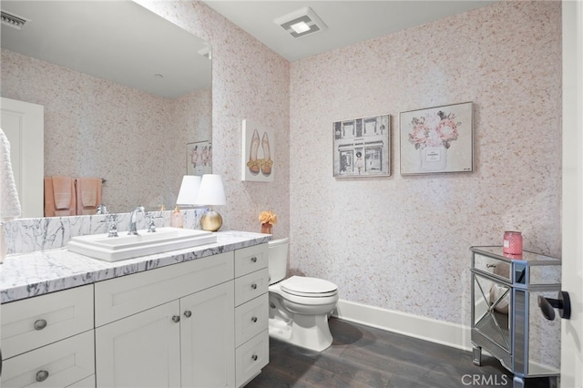 23500 Park Sorrento Unit H32, Calabasas, CA 91302 - bathroom with vanity, wood finished floors, and wallpapered walls