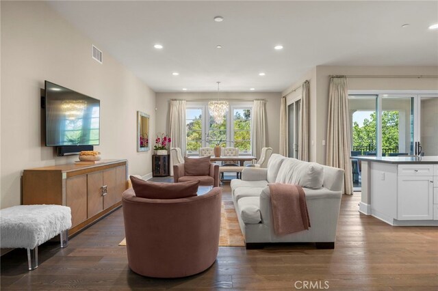 23500 Park Sorrento Unit H32, Calabasas, CA 91302 - living area featuring recessed lighting, dark wood-style flooring, and a chandelier