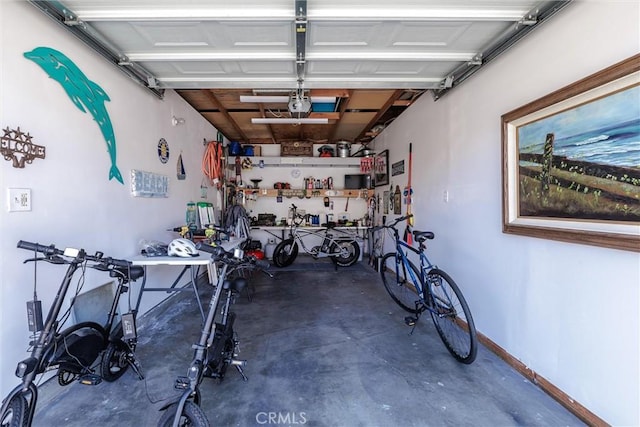 309 Sequoia St Unit 3, Morro Bay, CA 93442 - garage with a garage door opener and a workshop area