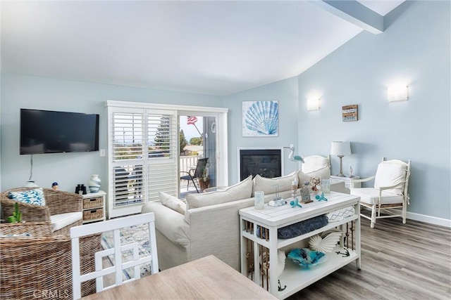 309 Sequoia St Unit 3, Morro Bay, CA 93442 - living area featuring a glass covered fireplace and wood finished floors