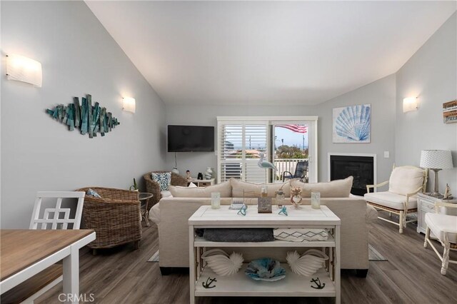 309 Sequoia St Unit 3, Morro Bay, CA 93442 - living room featuring lofted ceiling, dark wood finished floors, and a glass covered fireplace