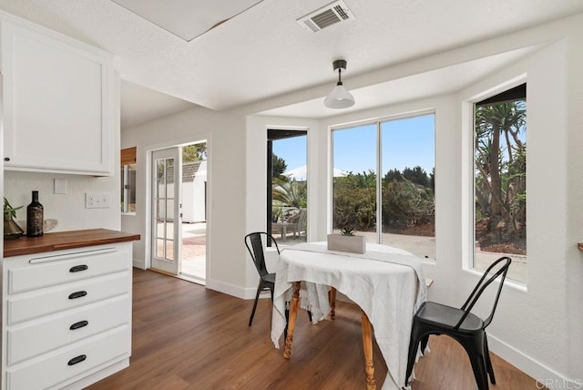 2663 Sutter St, Carlsbad, CA 92010 - dining area with healthy amount of natural light and dark wood-type flooring