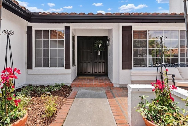 2663 Sutter St, Carlsbad, CA 92010 - view of exterior entry featuring a tiled roof and stucco siding