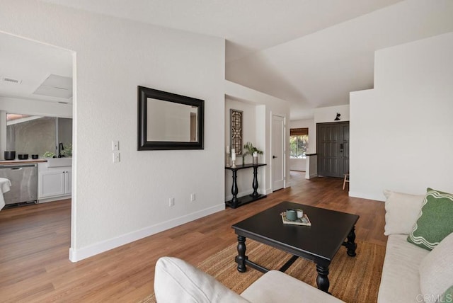 2663 Sutter St, Carlsbad, CA 92010 - living area with wood finished floors and lofted ceiling