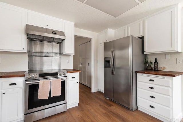 2663 Sutter St, Carlsbad, CA 92010 - kitchen featuring wood counters, stainless steel appliances, under cabinet range hood, dark wood-style flooring, and white cabinets