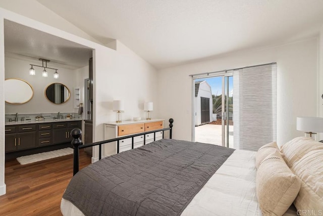 2663 Sutter St, Carlsbad, CA 92010 - bedroom featuring wood finished floors, access to exterior, ensuite bathroom, and rail lighting