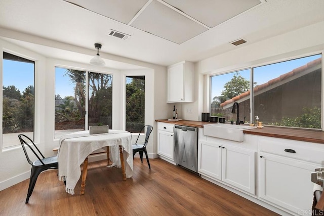 2663 Sutter St, Carlsbad, CA 92010 - kitchen with dishwasher, plenty of natural light, wooden counters, and wood finished floors
