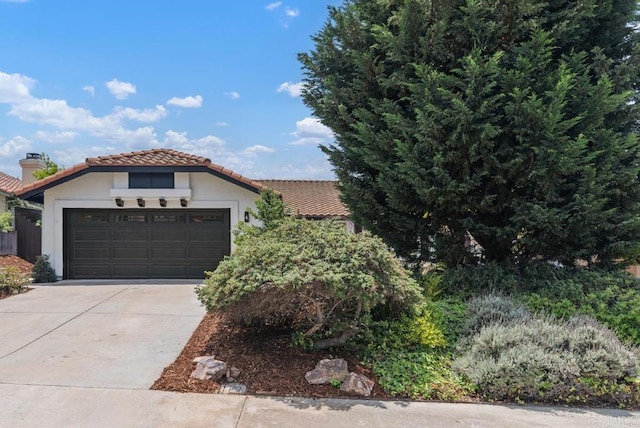 2663 Sutter St, Carlsbad, CA 92010 - view of front facade featuring a tile roof, driveway, an attached garage, a chimney, and stucco siding