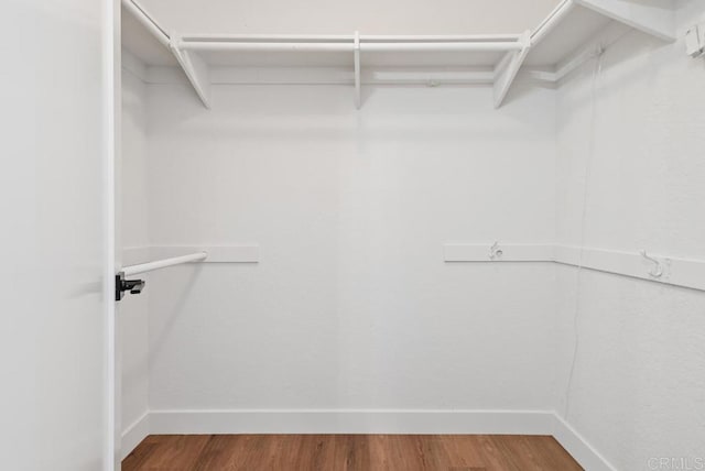 2663 Sutter St, Carlsbad, CA 92010 - walk in closet featuring wood finished floors