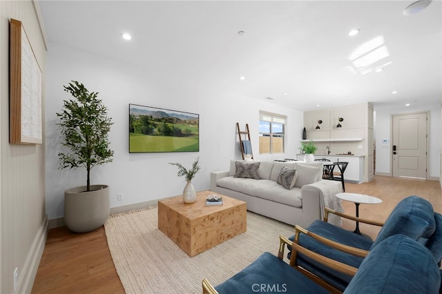 16229 Orizaba Ave, Paramount, CA 90723 - living area with light wood finished floors and recessed lighting