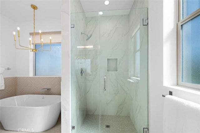 16229 Orizaba Ave, Paramount, CA 90723 - bathroom with a marble finish shower, a freestanding tub, a chandelier, and recessed lighting