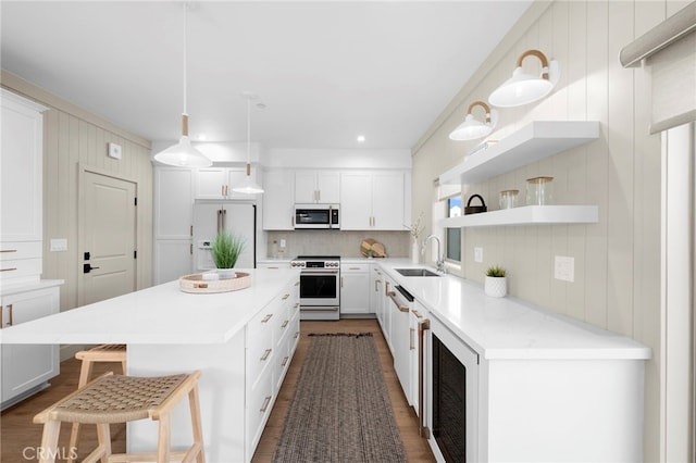 16229 Orizaba Ave, Paramount, CA 90723 - kitchen with electric range, high end white fridge, beverage cooler, a kitchen breakfast bar, and open shelves