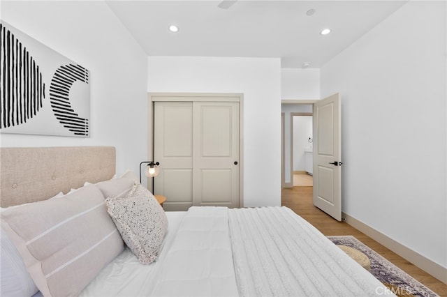 16229 Orizaba Ave, Paramount, CA 90723 - bedroom featuring light wood finished floors, recessed lighting, and a closet