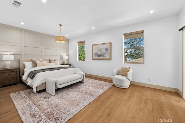 16229 Orizaba Ave, Paramount, CA 90723 - bedroom featuring recessed lighting, light wood finished floors, and a decorative wall