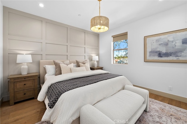 16229 Orizaba Ave, Paramount, CA 90723 - bedroom with a decorative wall, wood finished floors, and recessed lighting