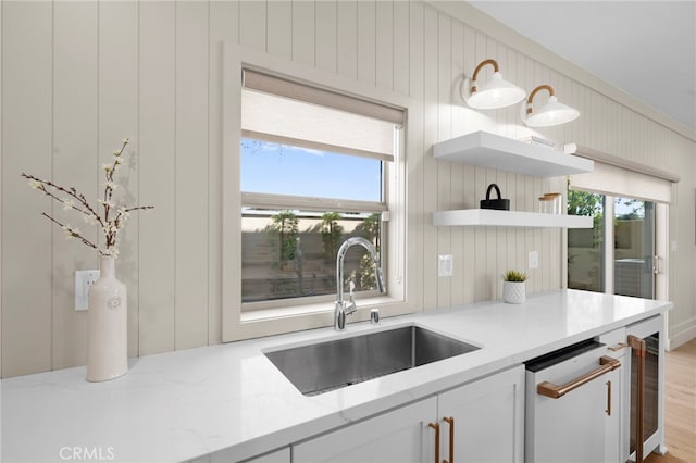 16229 Orizaba Ave, Paramount, CA 90723 - kitchen with wine cooler, plenty of natural light, open shelves, and light stone countertops