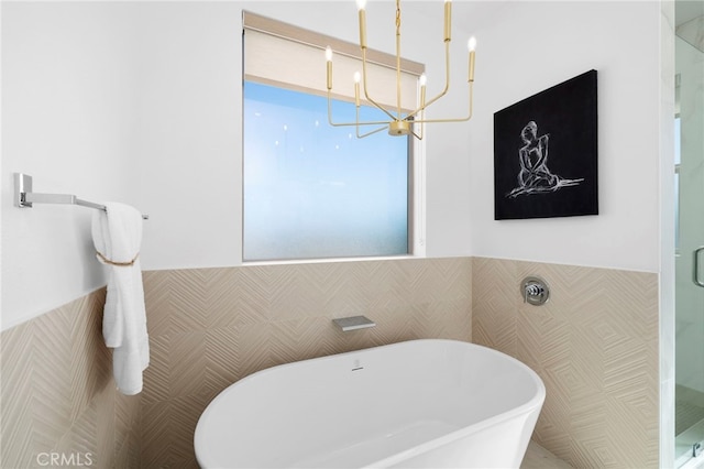 16229 Orizaba Ave, Paramount, CA 90723 - full bathroom featuring wainscoting, a chandelier, a freestanding tub, and a shower stall