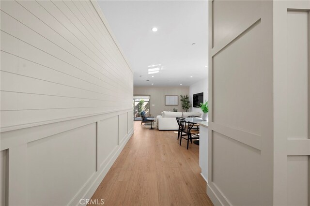 16229 Orizaba Ave, Paramount, CA 90723 - corridor with light wood-style floors and recessed lighting