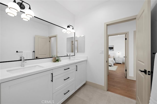 16229 Orizaba Ave, Paramount, CA 90723 - ensuite bathroom with double vanity and baseboards