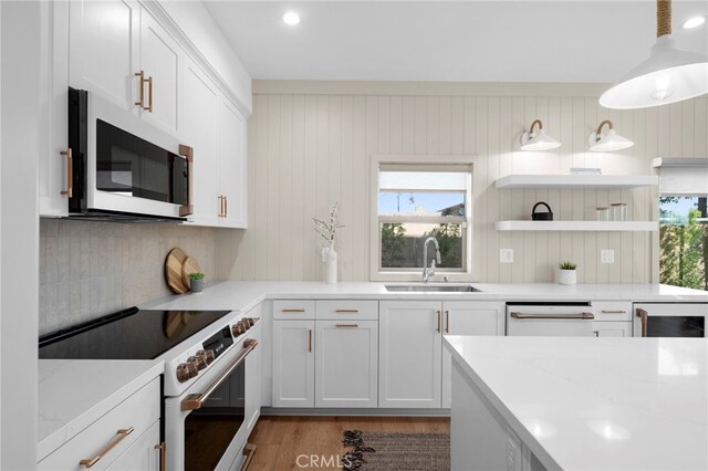 16229 Orizaba Ave, Paramount, CA 90723 - kitchen featuring white appliances, healthy amount of natural light, and white cabinets