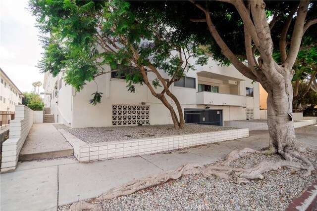 8710 Delgany Ave Unit 15, Playa Del Rey, CA 90293 - view of front of property with stucco siding and stairway
