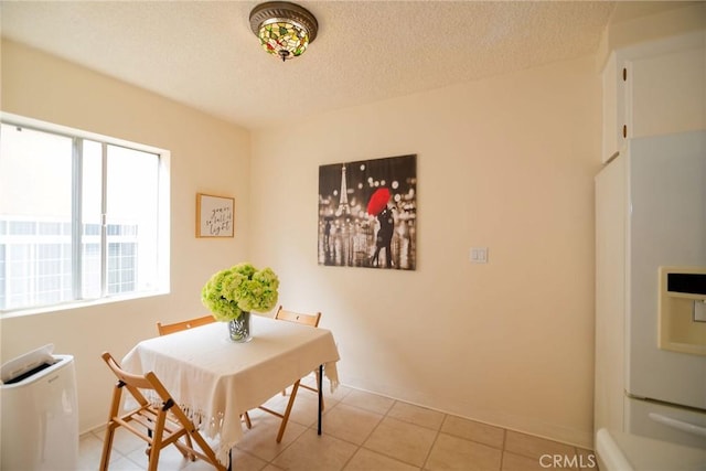 8710 Delgany Ave Unit 15, Playa Del Rey, CA 90293 - dining space with a textured ceiling and light tile patterned flooring
