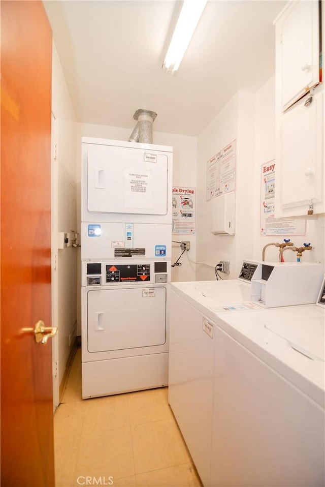 8710 Delgany Ave Unit 15, Playa Del Rey, CA 90293 - community laundry featuring stacked washer / drying machine, washer and clothes dryer, and light tile patterned flooring