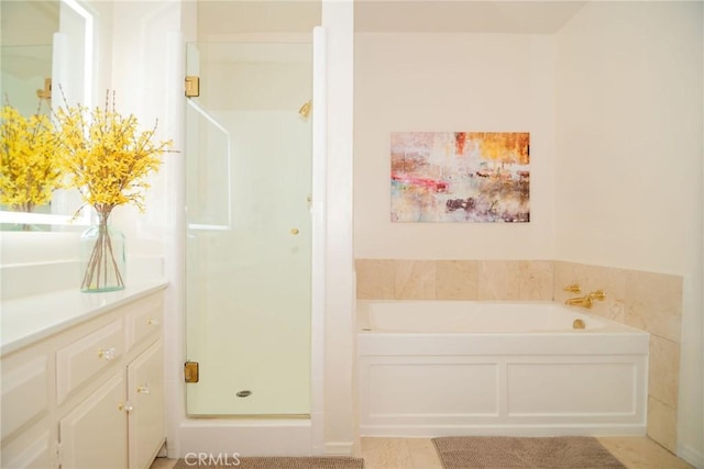 8710 Delgany Ave Unit 15, Playa Del Rey, CA 90293 - bathroom featuring a shower stall, a garden tub, vanity, and tile patterned flooring