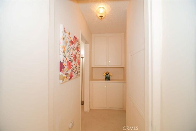 8710 Delgany Ave Unit 15, Playa Del Rey, CA 90293 - hall featuring a textured ceiling